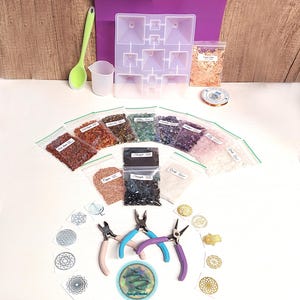 May include: A craft kit for making crystal pyramids includes a variety of colored crystals, a silicone mold, wire, pliers, and a set of geometric stencils.