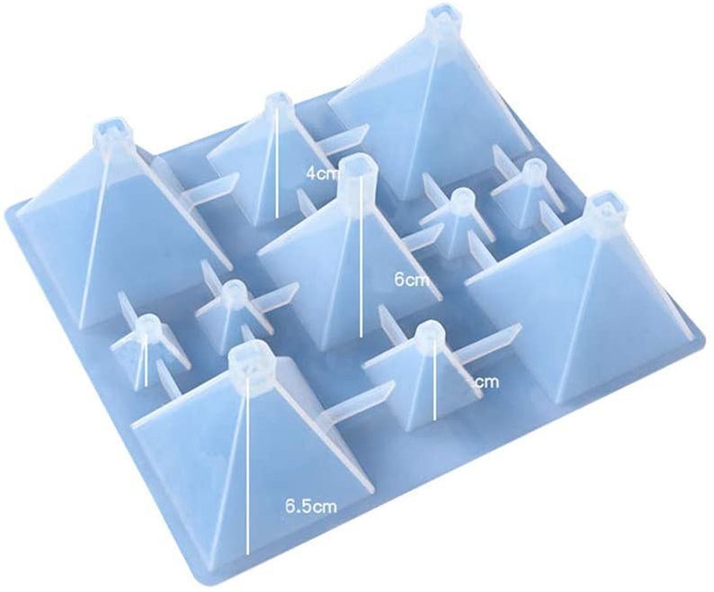 May include: A clear silicone mold with nine pyramid-shaped cavities. The mold is designed to create resin crafts. The mold measures 6.5 cm by 6 cm by 4 cm.