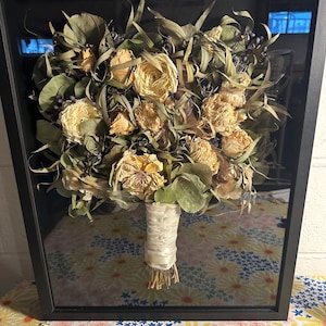 Air dried bouquet in black shadow box. these flowers were dried by the client. We can make shadow box with your Predried flowers or resin pieces can be made with them.