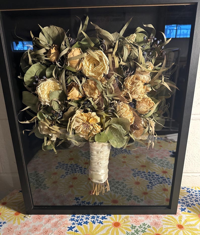 Air dried bouquet in black shadow box. these flowers were dried by the client. We can make shadow box with your Predried flowers or resin pieces can be made with them.