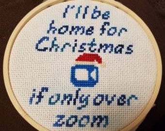 Ne serait-ce que zoomer sur le motif de point de croix de Noël