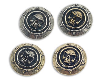 May include: Four round metal buttons with a skull and snake design. The buttons are in two different finishes: silver and gold.