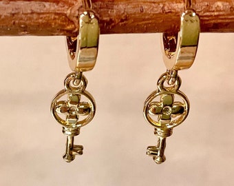Gold huggie hoop earrings with key charm