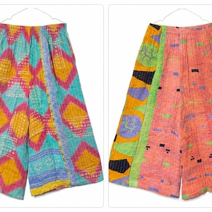 May include: Two pairs of wide-leg trousers featuring vibrant, multi-colored patchwork patterns. The left pair displays a turquoise, pink, and yellow diamond motif, while the right pair showcases an orange, yellow, and green abstract geometric design.