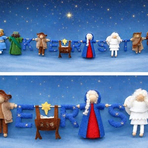 Könnte beinhalten: Eine Filzgirlande mit kleinen Krippenfiguren, die mit blauen Filzbuchstaben abwechseln, welche das Wort "CHRIST" bilden. Die Figuren umfassen Könige, einen Hirten, eine Krippe mit gelbem Stern, eine Figur im blauen Umhang und einen Engel.