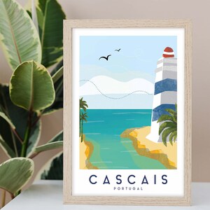 May include: Framed art print featuring a coastal scene with a lighthouse. The lighthouse has blue and white stripes and a red top. The artwork depicts a beach, ocean, and palm trees under a blue sky. The word "CASCAIS" and "PORTUGAL" are printed at the bottom.