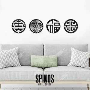May include: Four black metal wall decor pieces in the shape of circles with intricate Chinese characters and designs. The decor is displayed on a white wall above a gray couch with pillows.