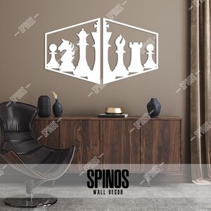 May include: White wooden wall decor featuring a chessboard design with various chess pieces. The decor is mounted on a brown wall above a wooden cabinet. The text "SPINOS WALL DECOR" is visible at the bottom of the image.