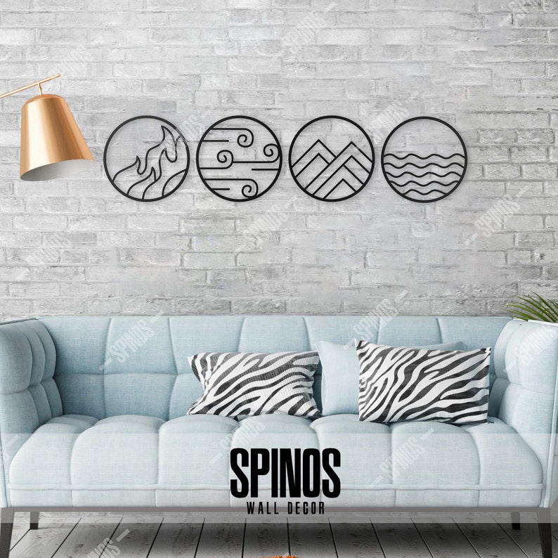 May include: Four black metal wall decor circles with different designs: fire, wind, mountains, and water. The circles are hanging on a white brick wall above a light blue couch with black and white zebra print throw pillows. The text "SPINOS WALL DECOR" is printed below the couch.