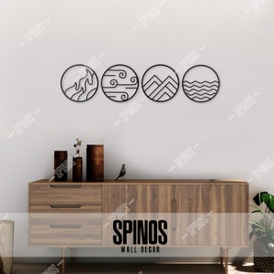 May include: Four black metal circles with different designs representing the four elements: fire, air, earth, and water. The circles are mounted on a white wall above a wooden dresser with the text "SPINOS WALL DECOR" on the front.