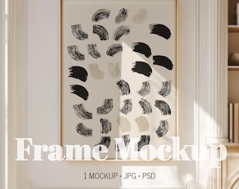 May include: A framed art print featuring a beige background with a pattern of black and light beige brushstrokes. The gold frame surrounds the artwork. The text "Frame Mockup" is displayed at the bottom of the frame, along with "1 MOCKUP . JPG . PSD".