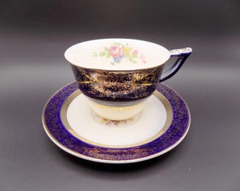 Taza y platillo vintage "Century" Aristocrat azul cobalto con diseño floral y detalles en oro de 23 quilates, de Salem USA, años 30-50.