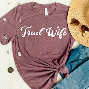 This is a picture of a traditional wife wearing a trad wife t shirt.