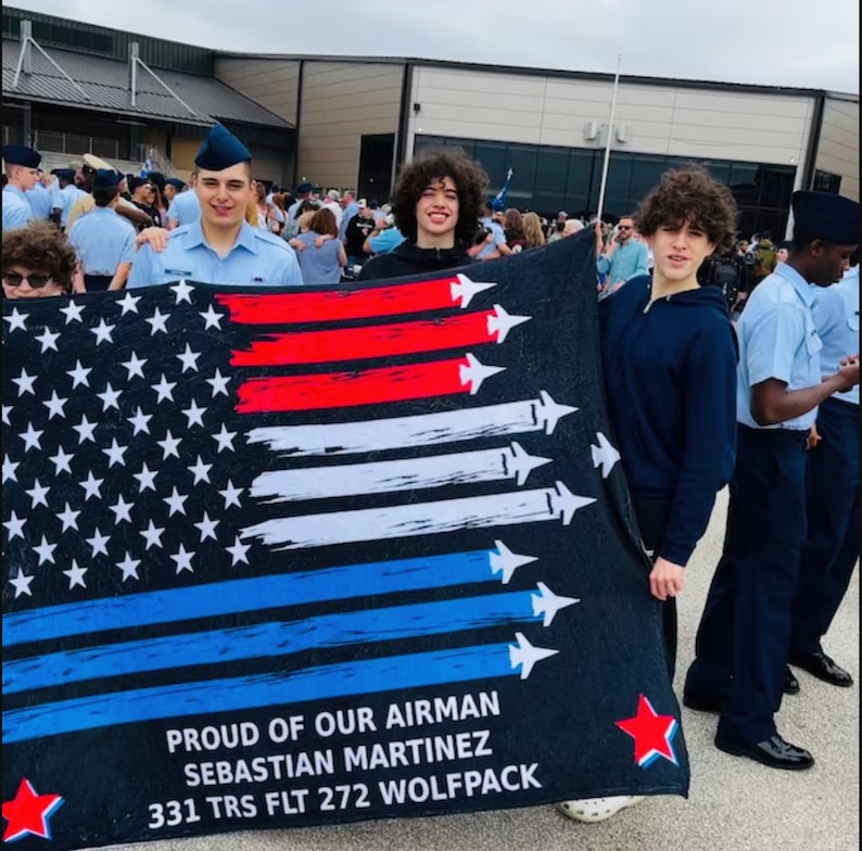 This is a picture of a custom BMT blanket. It is a personalized blanket for the Air Force Airman Graduate for a graduation gift.