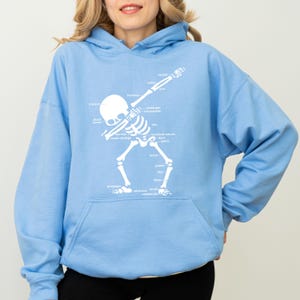 Medical anatomy hoodie showing skeletal bone labels. Labeled skull bone diagram apparel for doctors and nurses