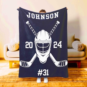 Custom hockey blanket in indigo with helmet and sticks design personalized for players – Moms Next Adventure