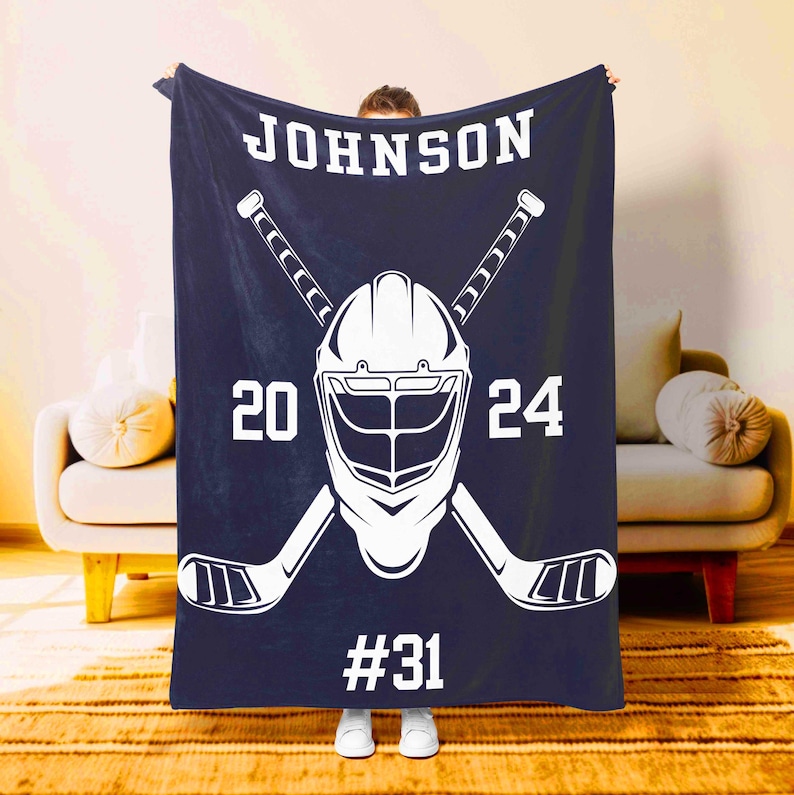 Custom hockey blanket in indigo with helmet and sticks design personalized for players – Moms Next Adventure
