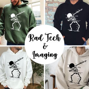 May include: Four hoodies in different colors: green, black, white, and beige. Each hoodie features a white skeleton graphic in a dabbing pose with anatomical labels. The text "Rad Tech & Imaging" is in the center.