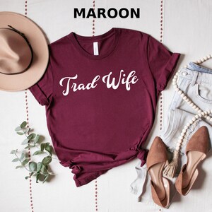 This is a picture of a traditional wife wearing a trad wife t shirt.