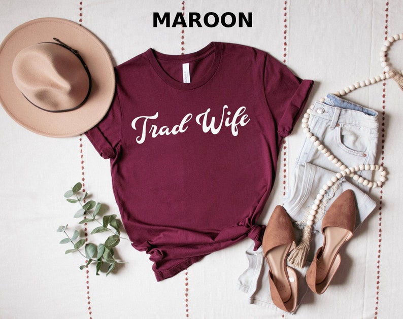 This is a picture of a traditional wife wearing a trad wife t shirt.