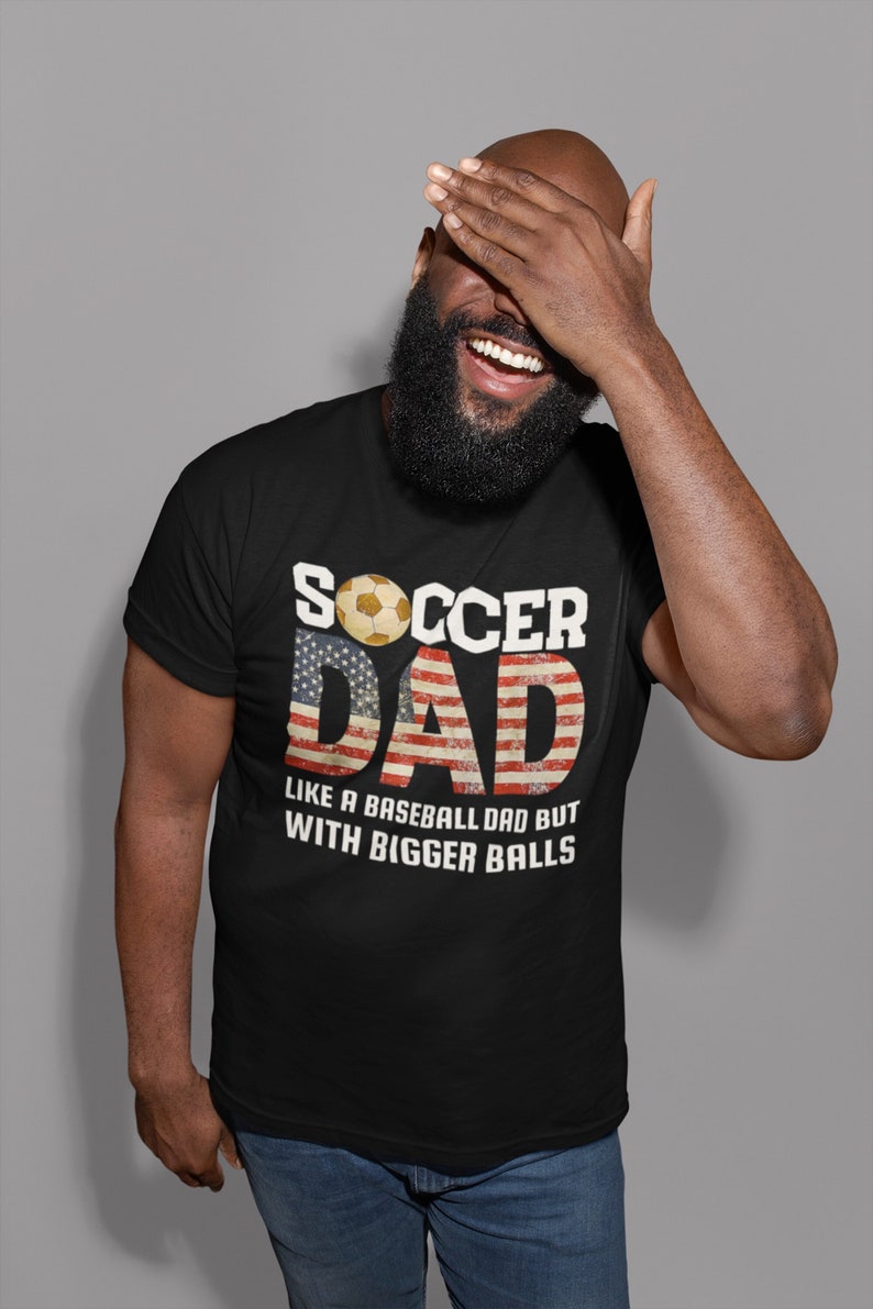 This is a picture of a soccer dad wearing a soccer t shirt.