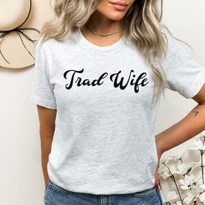 This is a picture of a traditional wife wearing a trad wife t shirt.