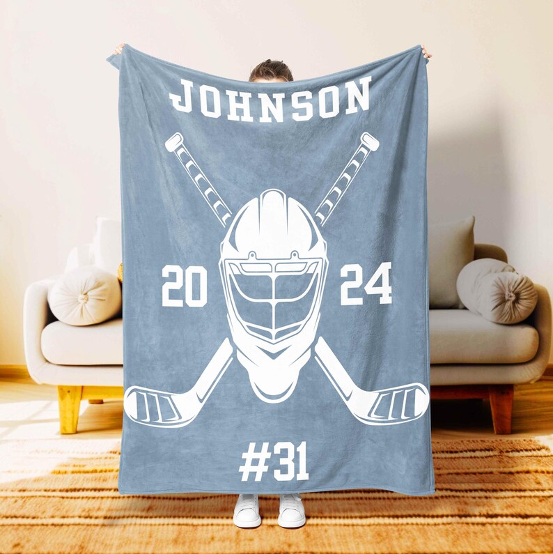 Personalized hockey player blanket in indigo with name and number – Moms Next Adventure