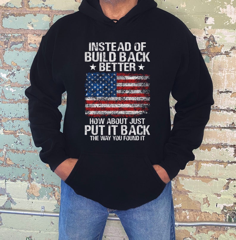 This is a picture of a man wearing a USA flag sweatshirt. The picture is of a distressed American flag, a distressed USA flag.