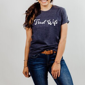 This is a picture of a traditional wife wearing a trad wife t shirt.