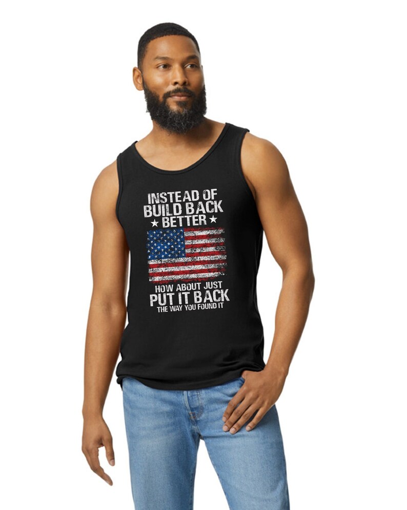 This is a picture of a man wearing a USA flag shirt. The picture is of a distressed American flag, a distressed USA flag.