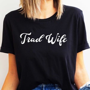 This is a picture of a traditional wife wearing a trad wife t shirt.