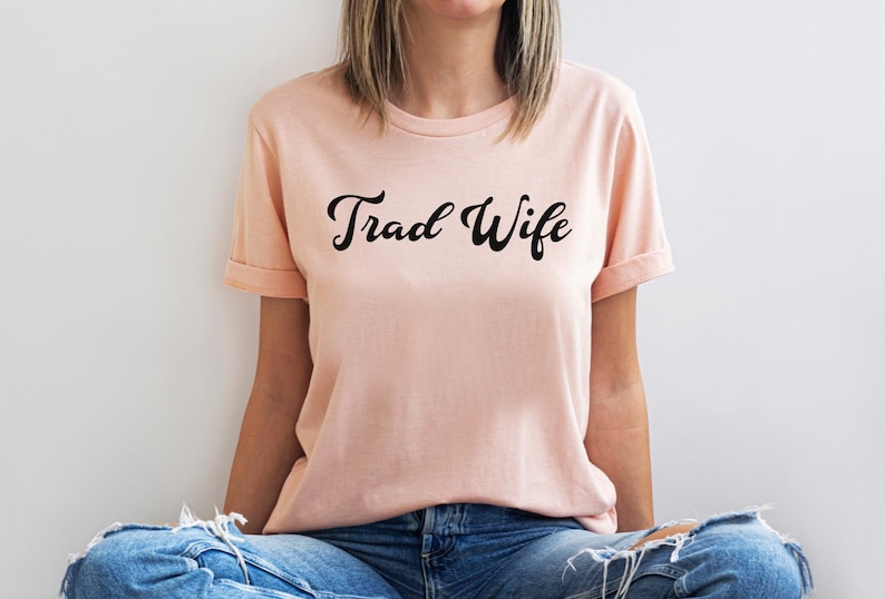 This is a picture of a traditional wife wearing a trad wife t shirt.