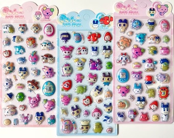 May include: Three vertical sheets of colorful, puffy stickers featuring various cartoon characters, animals, and digital pet devices. Each sheet is labeled with the text POP SEAL at the top and contains numerous small, glossy, raised adhesive decals.