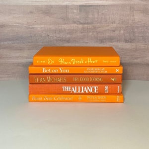 bright orange aesthetic book stack