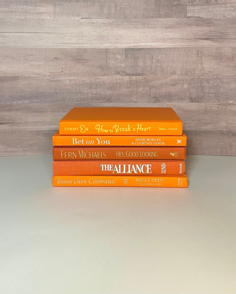 bright orange aesthetic book stack