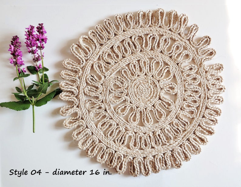 May include: A natural fiber round placemat with a woven design. The placemat is 16 inches in diameter and has a light beige color.