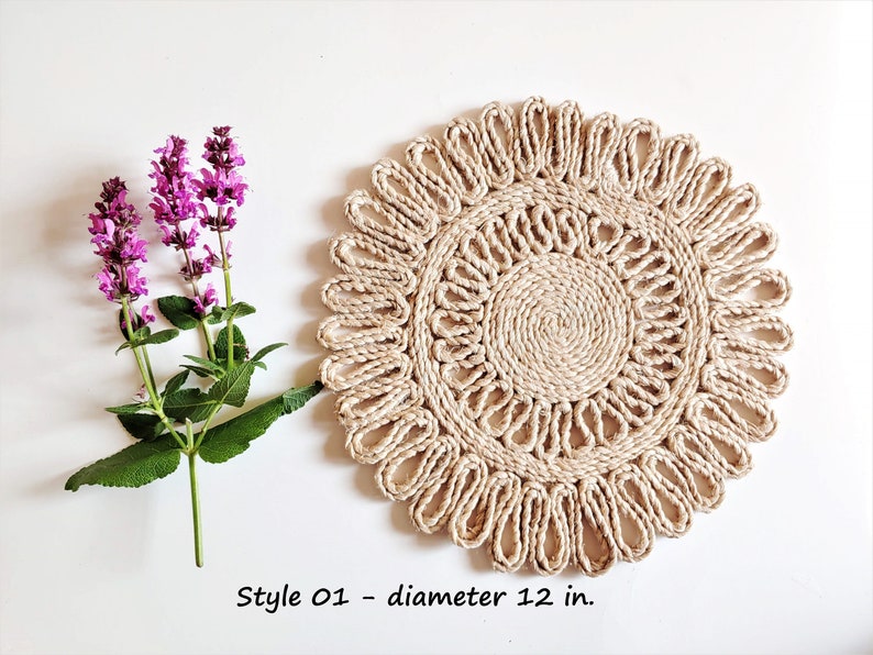 May include: A round, natural fiber placemat with a woven design. The placemat is 12 inches in diameter and has a light brown color.