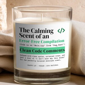 May include: A clear glass candle with a white label featuring black and green text that reads: The Calming Scent of an Error-Free Compilation, Code is on Main.cpp from Bug_Hunt, Clean Code Comments, and other descriptive developer-themed text.