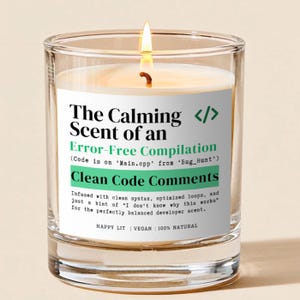 May include: A lit candle in a clear glass jar with a white label featuring black and green text that reads: The Calming Scent of an Error-Free Compilation, Code is on Main.cpp from Bug_Hunt, Clean Code Comments, and other descriptive text.