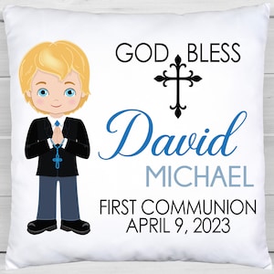 May include: White pillow with a blue and black illustration of a boy in a suit holding a rosary. The text "God Bless David Michael First Communion April 9, 2023" is printed on the pillow.