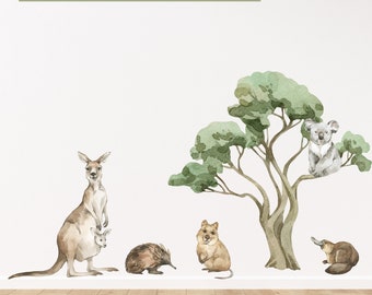 May include: Watercolor illustration of Australian animals, including a kangaroo with a joey, echidna, quokka, koala, and platypus. A tree is also featured. The text "Australian Animals Bundle Pack 1" is at the top.