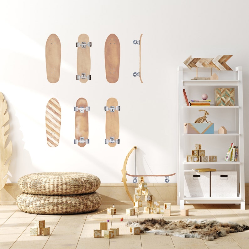 May include: A set of eight brown wooden skateboard wall decals. The decals are arranged in a staggered pattern on a white wall. There are also wooden blocks and a wooden arrow on the wall.