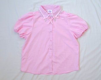 Pastel Pink Collared Puff Sleeve Blouse With Heart Rhinestone Buttons, Lace Trim with Woven Ribbon Bow Detail & Cross Charms on Collar