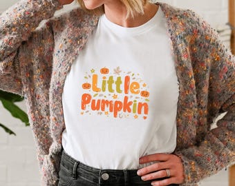 Want to stand out this spooky season? Unisex The Little Pumpkin tee is playful, vibrant, and made to bring smiles wherever you go.