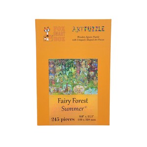 May include: A box for a 245 piece wooden jigsaw puzzle featuring a colorful illustration of a fairy forest scene. The box is orange and features the text "Fairy Forest Summer" and "FOX SMART BOX ARTFUZZLE". The puzzle measures 9.0 inches by 12.5 inches.