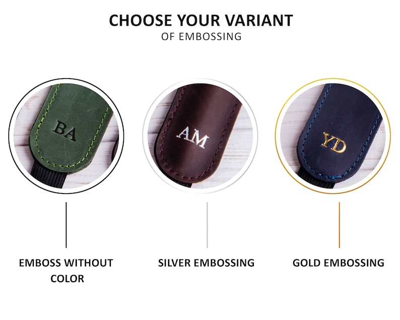 May include: Three leather camera straps with different embossing options. The first strap is green with black stitching and the initials "BA" embossed in black. The second strap is brown with white stitching and the initials "AM" embossed in silver. The third strap is black with blue stitching and the initials "YD" embossed in gold. The text below each strap reads "Emboss Without Color", "Silver Embossing", and "Gold Embossing".