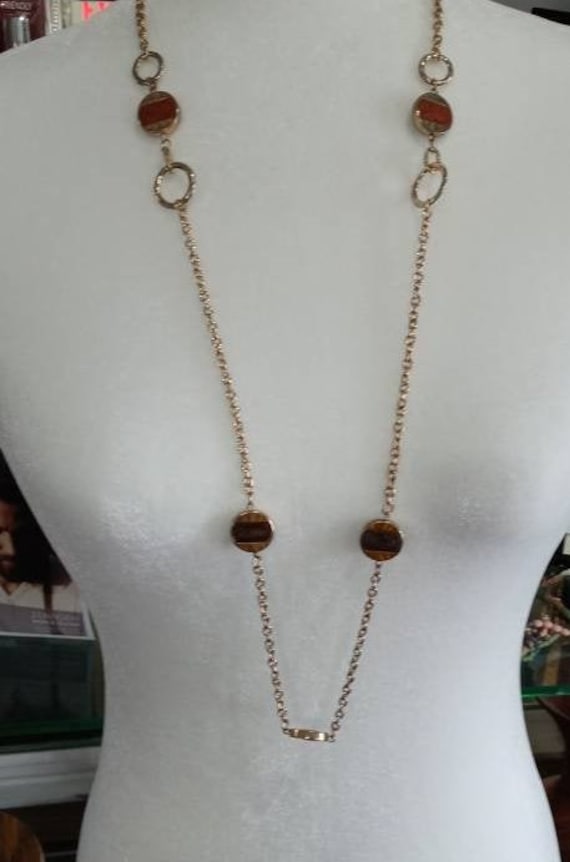 Long Gold Tone Necklace that has Goldstone and Bro