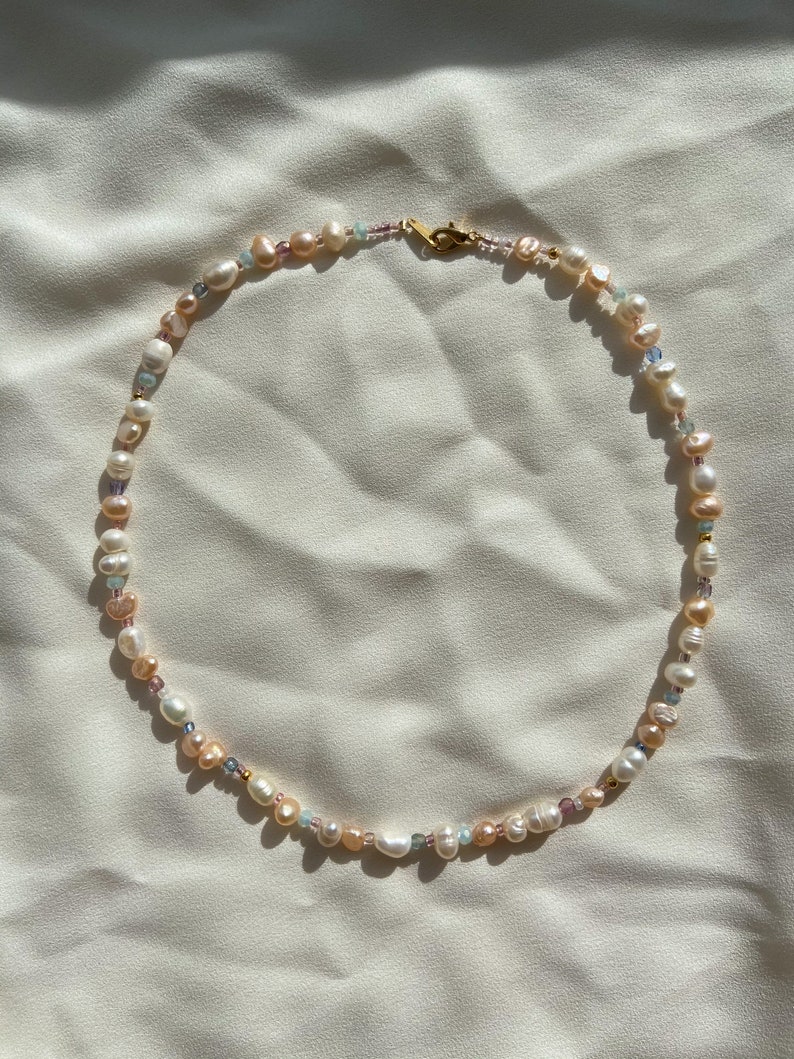 pearl necklace with beads and gold clasp