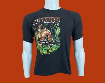 Vintage 80s Rambo Movie Sylvester Stallone Single Stitch Fantasy Black Cotton Polyester T Shirt Pre-Owned 18.5" x 23" Size S