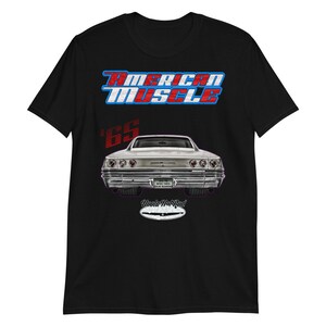 May include: A black t-shirt with a white and red "American Muscle" graphic and a silver 1965 Chevrolet Impala. The car is shown from the rear and has the text "Uncle Mat's Rod" on the back.